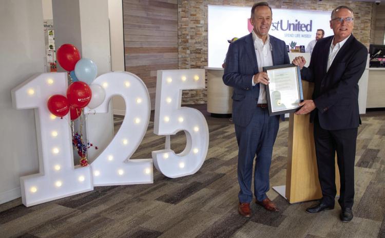 First United Bank is celebrating its 125th anniversary and Durant Mayor Martin Tucker, right, presented First United CEO Greg Massey with a proclamation from the City of Durant. Matt Swearengin | Durant Democrat