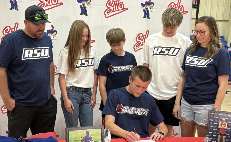 Silo High School graduate Lewis Cross signed a scholarship offer from Rogers State University where he will be on the track and field team. Kevin Farr | For the Democrat