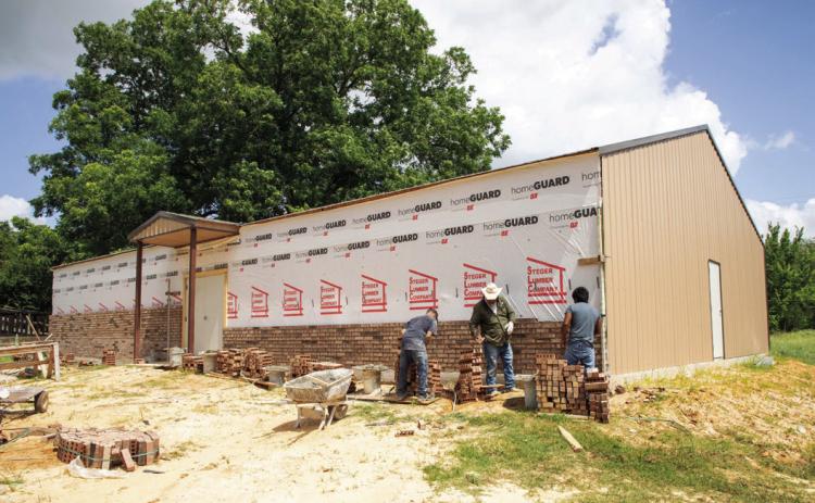 Workers have started placing bricks at the Feeding Hope building on East Florida Street. Matt Swearengin | Durant Democrat
