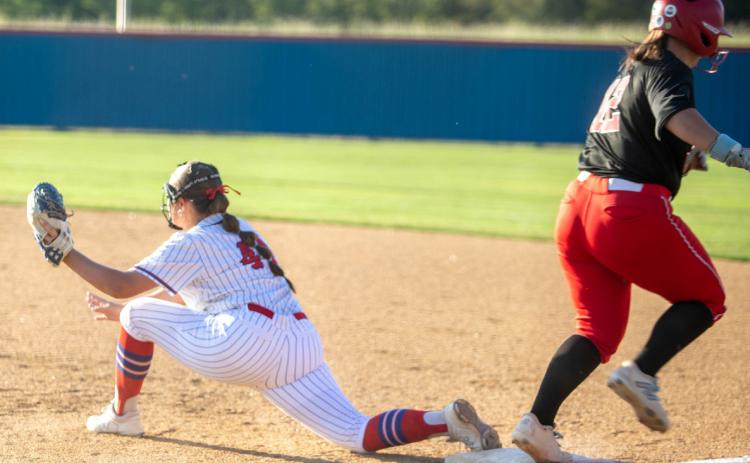 Lady Lion Emma Sherrer is shown on first base during the game with Sulphur.