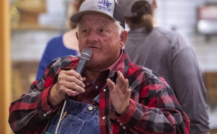 Auctioneer John Teel, who died May 29, often was the auctioneer for fundraising events, including the Durant High School Band homemade goods auction in 2024. Matt Swearengin | Democrat file photo