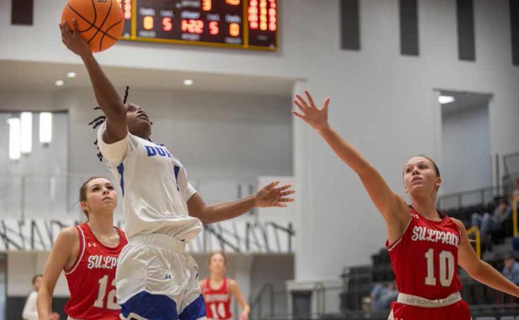 Lady Lion Iyana Wilson goes up for a basket during the recent Madill Winter Classic. Matt Swearengin | Durant Democrat