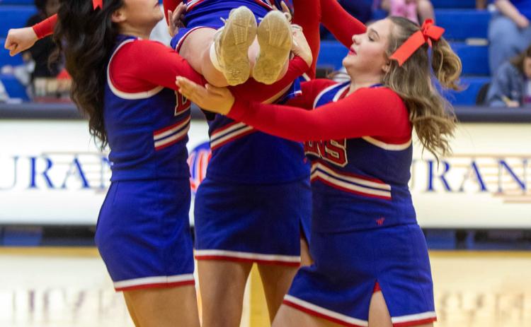 Durant High School cheerleaders performed during last week’s basketball games. Bottom left is Savannah Wells, bottom right Kinlee Goza, the top person is Blair Burrage and the person in the back is Lauryn Staneart. Matt Swearengin | Durant Democrat
