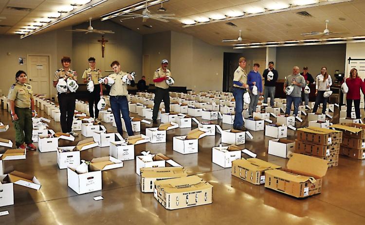 St. William Catholic Church provided food to 150 local military veterans on Dec. 7. Each veteran received a large turkey provided by Catholic charities and assorted delicacies. The United Way sponsored the event with generous assistance from Boy Scouts sponsored by Durant First United Methodist Church. Photo provided