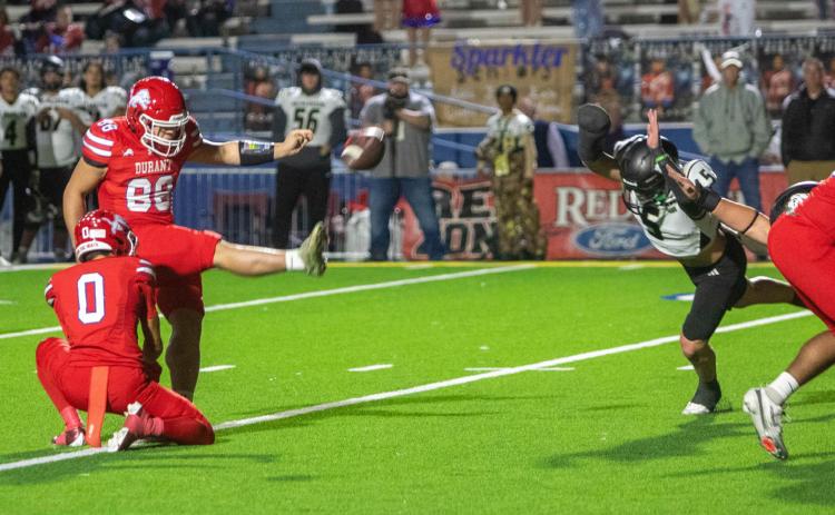 Durant Lion Otto Baskin kicks the ball and Lion Kacin Washington Mazey was holding it prior to the kick. Matt Swearengin | Durant Democrat