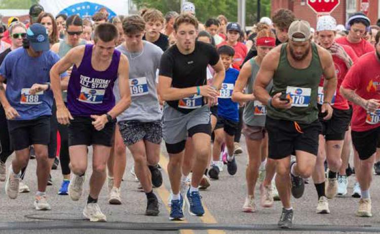 Runners take off from the starting line of The Owen Foundation Blazing 5K Run for autism. Matt Swearengin | Durant Democrat