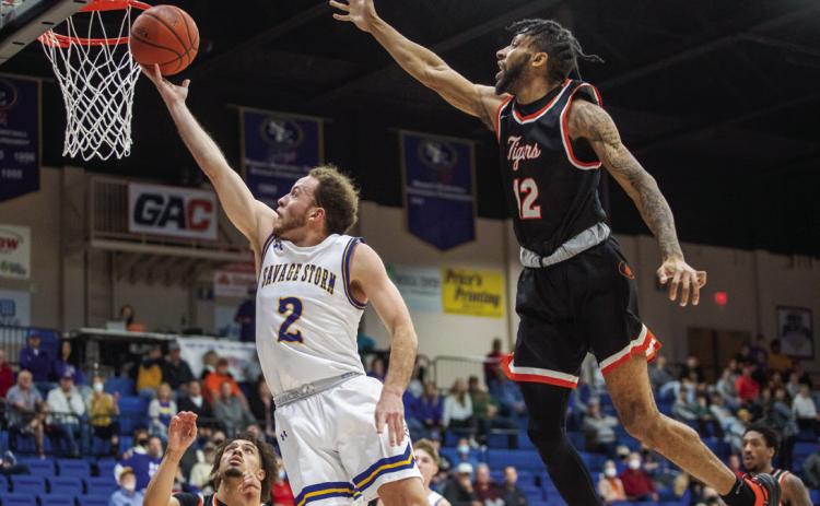 Adam Dworsky goes up for a basket in a January 2022 game with East Central. Dworsky is the new Silo Rebels basketball coach. Democrat file photo | Matt Swearengin