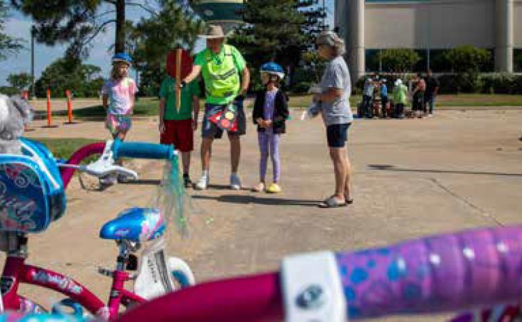 Gordon Eggleton of the Durant Rotary Club was among those teaching children bicycle safety during the Bike Rodeo by Durant Sustainability Coalition and Durant Trails &amp; Open Space. Matt Swearengin | Durant Democrat