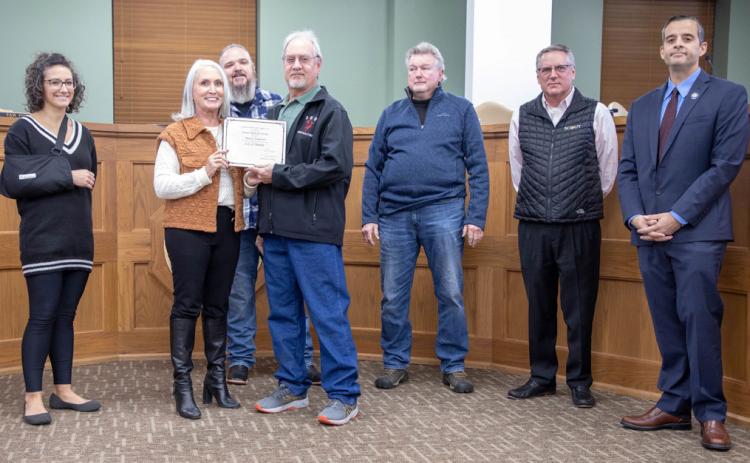 David Anderson, city garage employee, received an award from the Oklahoma Municipal League for 25 years of service with the city. He is shown with City Manager Pam Polk, council members Lauran Fuller, Humphrey Miller and Danny Sherrer and Mayor Martin Tucker and Vice Mayor Mike Simulescu. Not shown is Dustin Rudolf, Durant deputy fire chief, who received an award for 30 years of service.