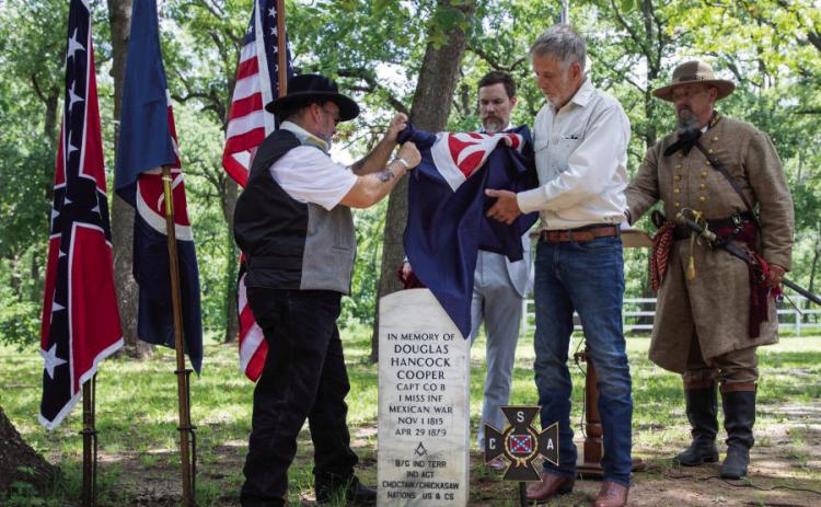 A headstone for Confederate Brigadier General Douglas Hancock Cooper is unveiled Saturday at the Fort Washita Confederate Cemetery. Among those shown are, Kevin Easterling, Terry Pierce and Erik McBroom, who is the commander of Oklahoma City Camp 481, Sons of Confederate Veterans. Matt Swearengin | Durant Democrat