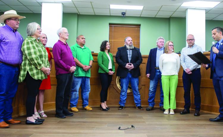 Durant Vice Mayor Mike Simulescu reads a proclamation for the Calvary Baptist Church Centennial Celebration. Matt Swearengin | Durant Democrat