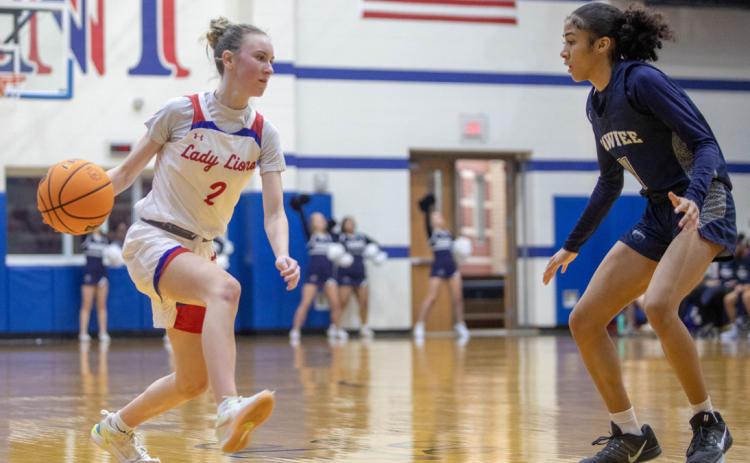 Lady Lion Avery Blackburn faces a Shawnee Lady Wolf. Matt Swearengin | Durant Democrat