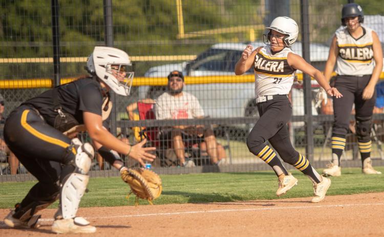 Calera Lady Bulldog Taryn Niblett runs to home plate in the game at Caddo.