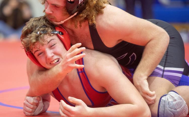 Lion Evan Smith wrestles in a recent home dual. Matt Swearengin | Durant Democrat