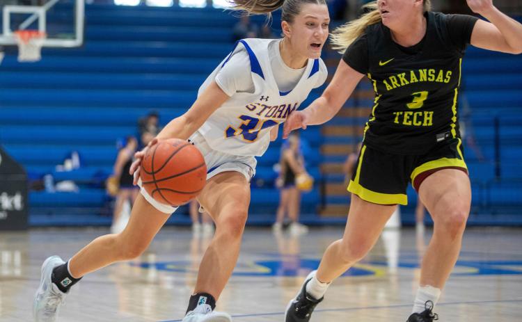 SE’s Holli Lindley moves down court beside an Arkansas Tech player. Matt Swearengin | Durant Democrat