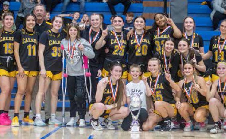 Calera Lady Bulldogs pose after winning the Bryan County Basketball Tournament championship game Saturday evening at Bloomer Sullivan Arena. The Lady Bulldogs defeated the Caddo Lady Bruins 46-43. Matt Swearengin | Durant Democrat