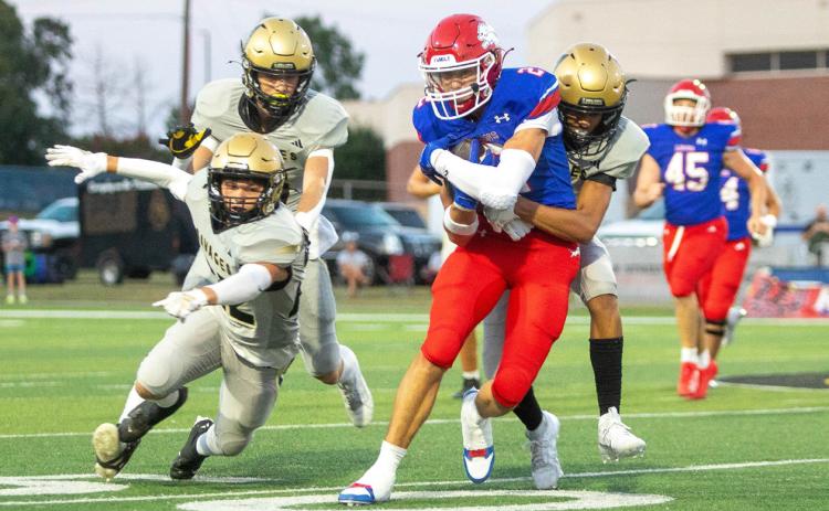 A Broken Bow Savage attempts a tackle on Lion Ryder Jones during the Sept. 6 homecoming game.