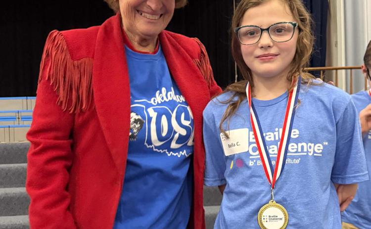 Long-time OSB supporter Patsi Nix Smith presented the medals to Bella and Abe Cooper from Calera for winning at Oklahoma School for the Blind’s regional Braille Challenge competition. Photos provided