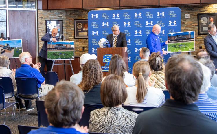 Architect renditions for the Southeastern Spend Life Wisely Stadium are unveiled during an annoucement last week at Bloomer Sullivan Arena. From left, Durant Schools Superintendent Mark Moring, SE athletics director Keith Baxter, SE President Dr. Thomas Newsom, head football coach Bo Atterberry and First United Bank CEO Greg Massey. Matt Swearengin | Durant Democrat