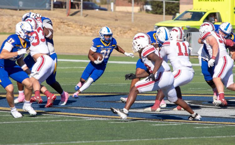 Savage Storm player Johnathon Cobb, middle, faces Southern Nazarene players. Matt Swearengin | Durant Democrat