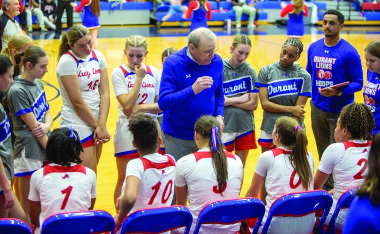 Durant Lady Lions basketball head coach Tony Robinson talks to his team during a time out in last week’s home game. During a Monday meeting, the Durant Board of Education voted to rename the high school gym the Robinson Family Gymnasium in honor of the family that su_ered the tragedy of the deaths of head coach Will Robinson and his daughter Clara during a Christmas Eve 2024 car accident. Matt Swearengin | Durant Democrat