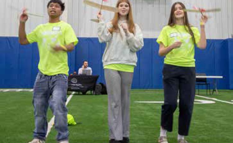 Ben Jacob, Gracie Burns and Drew Goodno, all of Broken Bow High School, fly balsa wood airplanes during the Southern Oklahoma Student Aero Day at Durant High School. Matt Swearengin | Durant Democrat