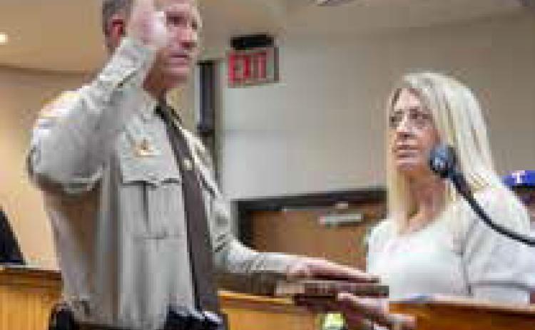 Joey Tucker was sworn in Monday as Bryan County Sheriff and he is shown with his wife Scarlett. Sheriff Johnny Christian passed away March 28 and Tucker was previously the undersheriff. There will be an election for sheriff next year. Matt Swearengin | Durant Democrat